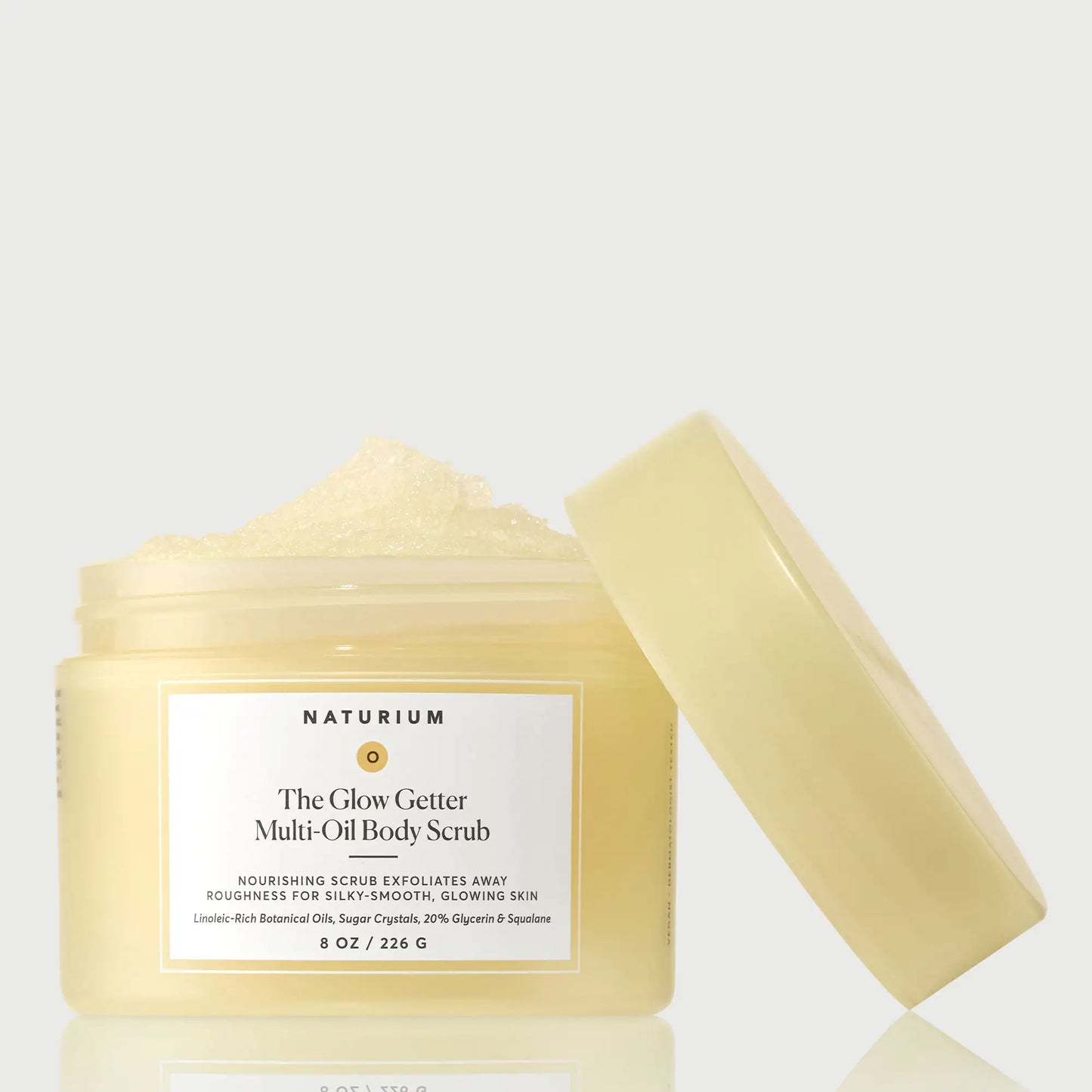 the-glow-getter-multi-oil-body-scrub-x9 NATR-40028-GlowGetter-Multi-Oil-Body-Scrub-Front-CapOff-bonebkgd.webp