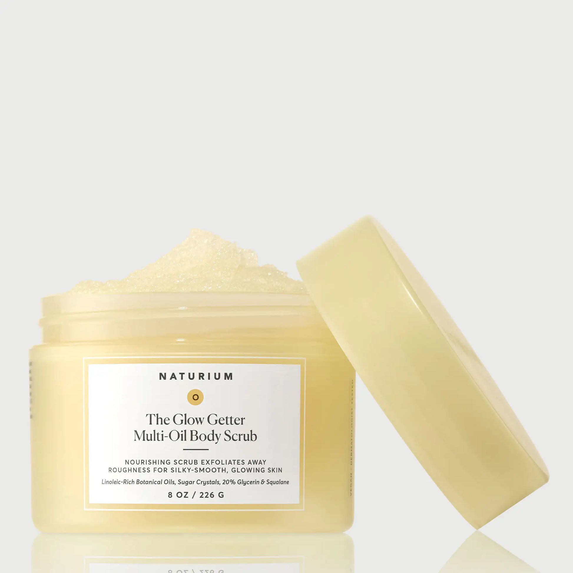 the-glow-getter-multi-oil-body-scrub-x9 NATR-40028-GlowGetter-Multi-Oil-Body-Scrub-Front-CapOff-bonebkgd.webp
